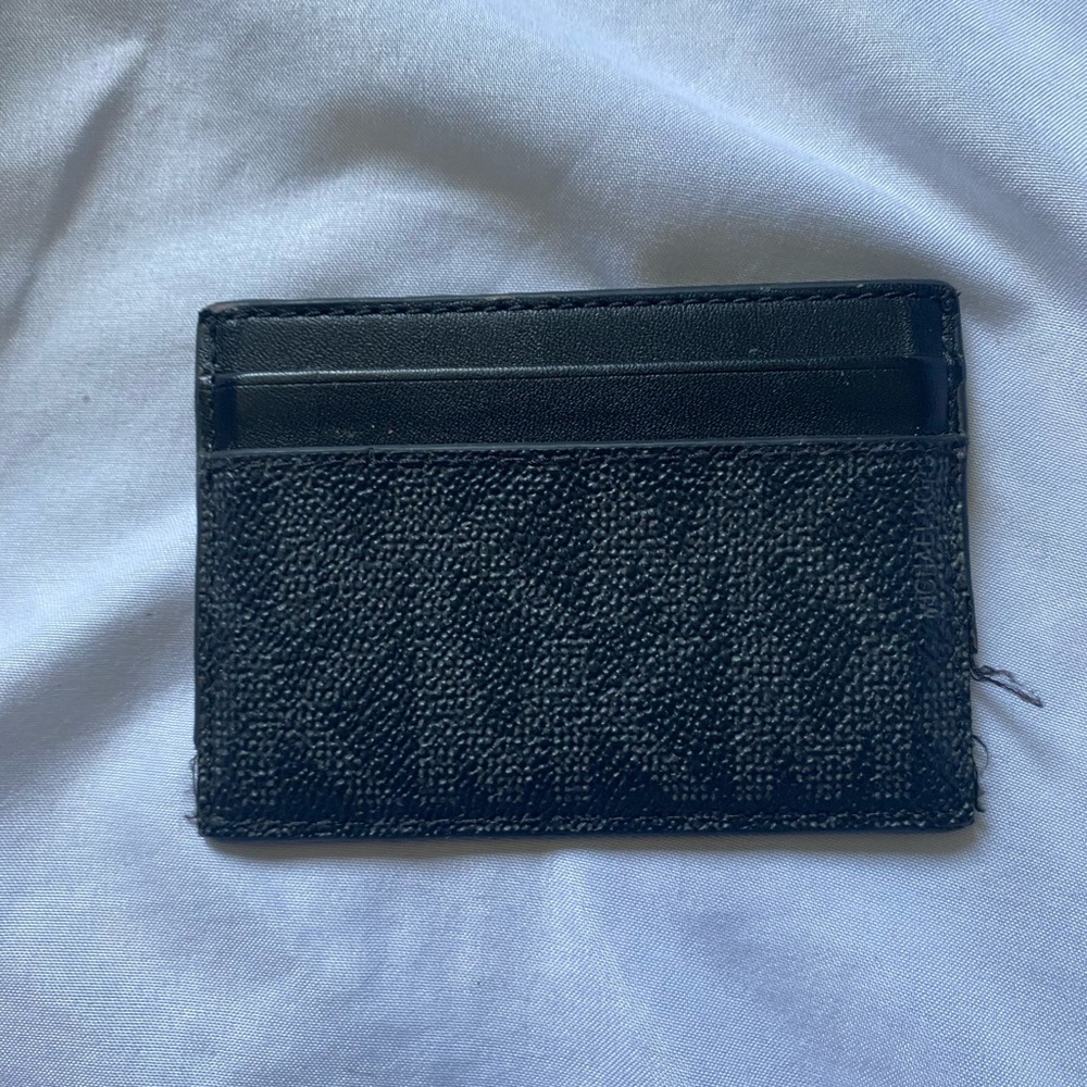 Black Micheal Kors Cardholder in decent condition.